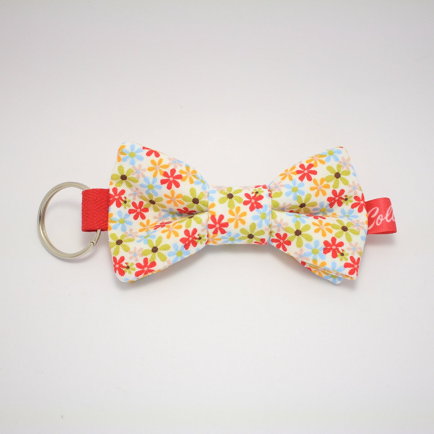 Porte-clés noeud papillon fleuri multicolore